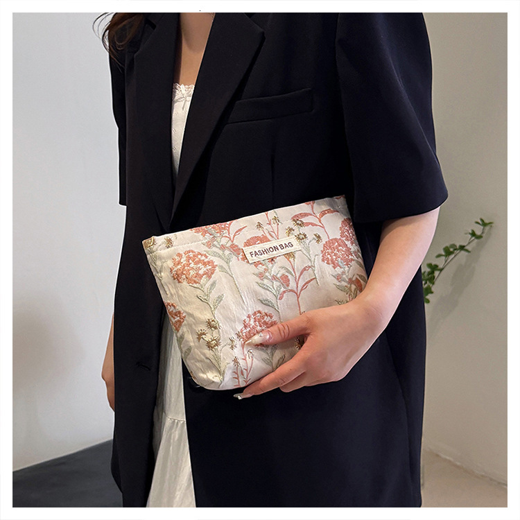 Small niche trend soft embossed portable travel storage toiletries large capacity canvas makeup bag designer crossbody bag shoulder bag