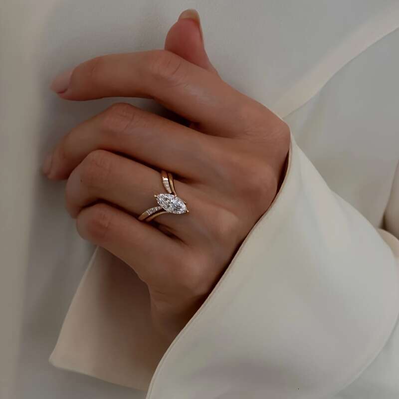 A two piece set of minimalist INS style S sterling Siery rings featuring oval Moissanite stone perfect for a unique and fashionable look