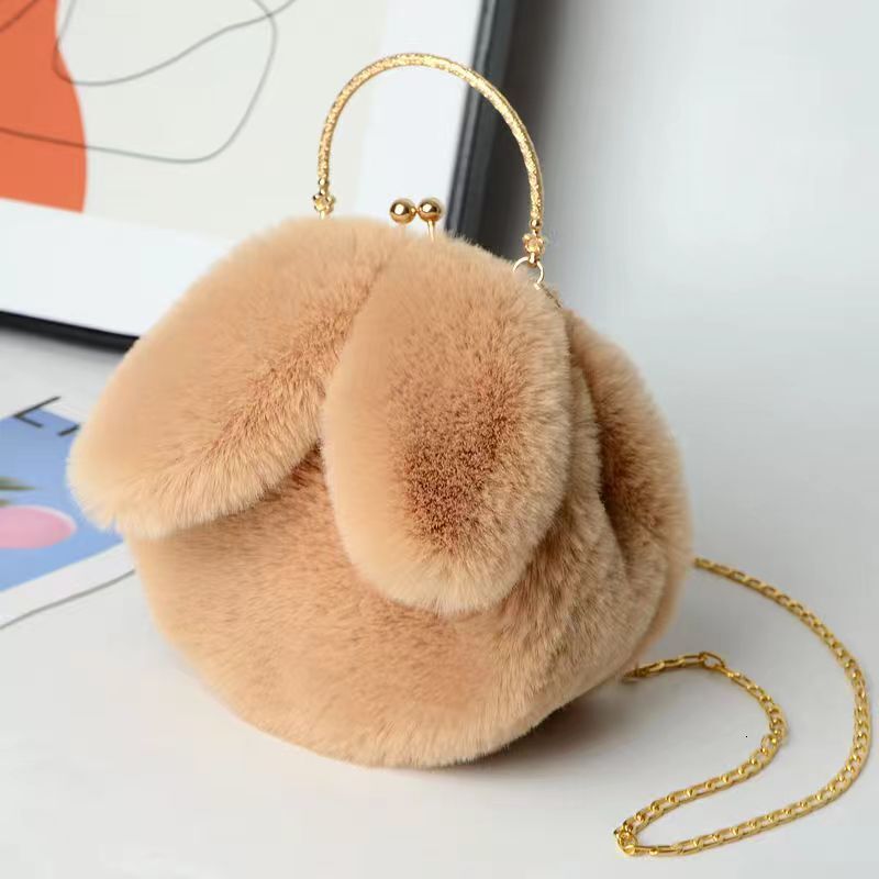 Plush shoulder trend women's handheld diagonal chain mobile phone multifunctional fashionable small round bag rabbit ear clip bag designer handba