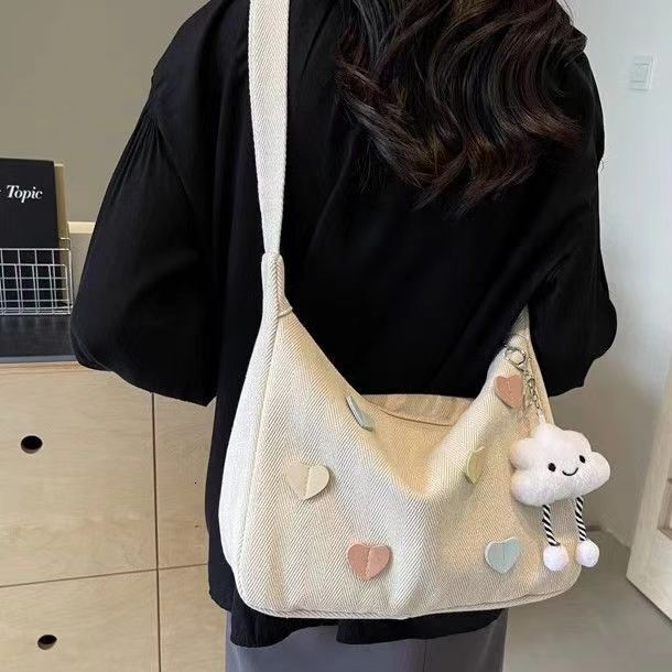 Spring new fashion slanted body large capacity commuting canvas women fashion s crossbody bag niche multifunctional fashion handbag designer shoulder 