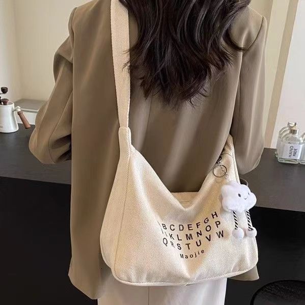 Spring new fashion slanted body large capacity commuting canvas women fashion s crossbody bag niche multifunctional fashion handbag designer shoulder 