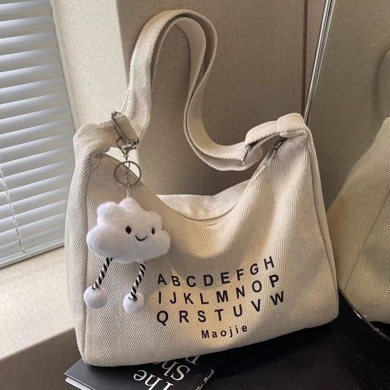 Spring new fashion slanted body large capacity commuting canvas women fashion s crossbody bag niche multifunctional fashion handbag designer shoulder 