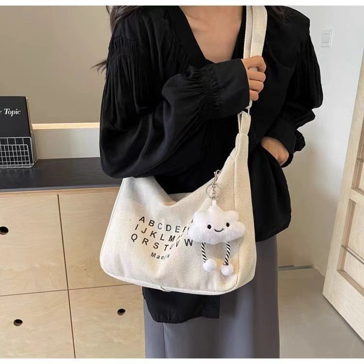 Spring new fashion slanted body large capacity commuting canvas women fashion s crossbody bag niche multifunctional fashion handbag designer shoulder 