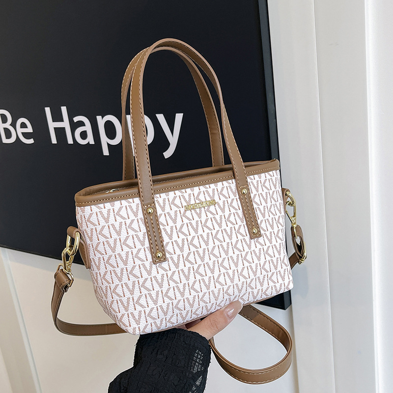 The new feeling prints the vegetable basket female bag popular crossbody bag fashionable commuting shoulder bag