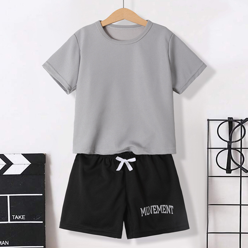 Summer boys' shorts set with waffle style short sleeves and letter printed shorts, suitable for children aged 4-12, featuring a stylish casual ou