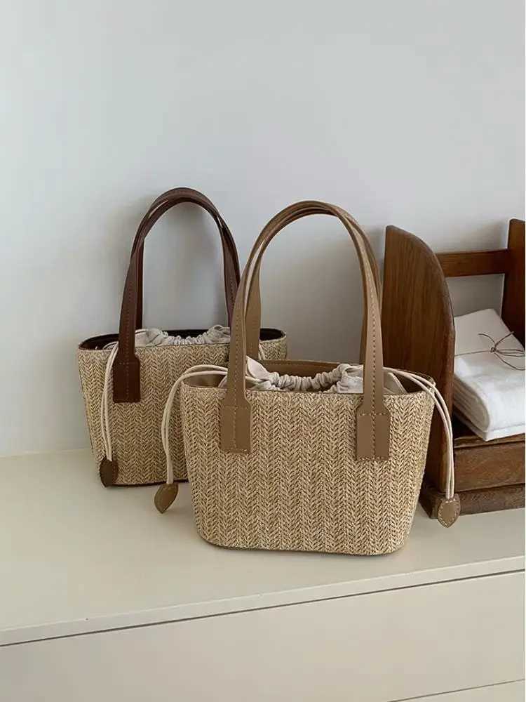 2023 Womens Leisure Grass Woven Handbag Drawstring Bucket One Shoulder Crossbody Bag Womens Travel Bohemian Vacation Beach Bag W250524