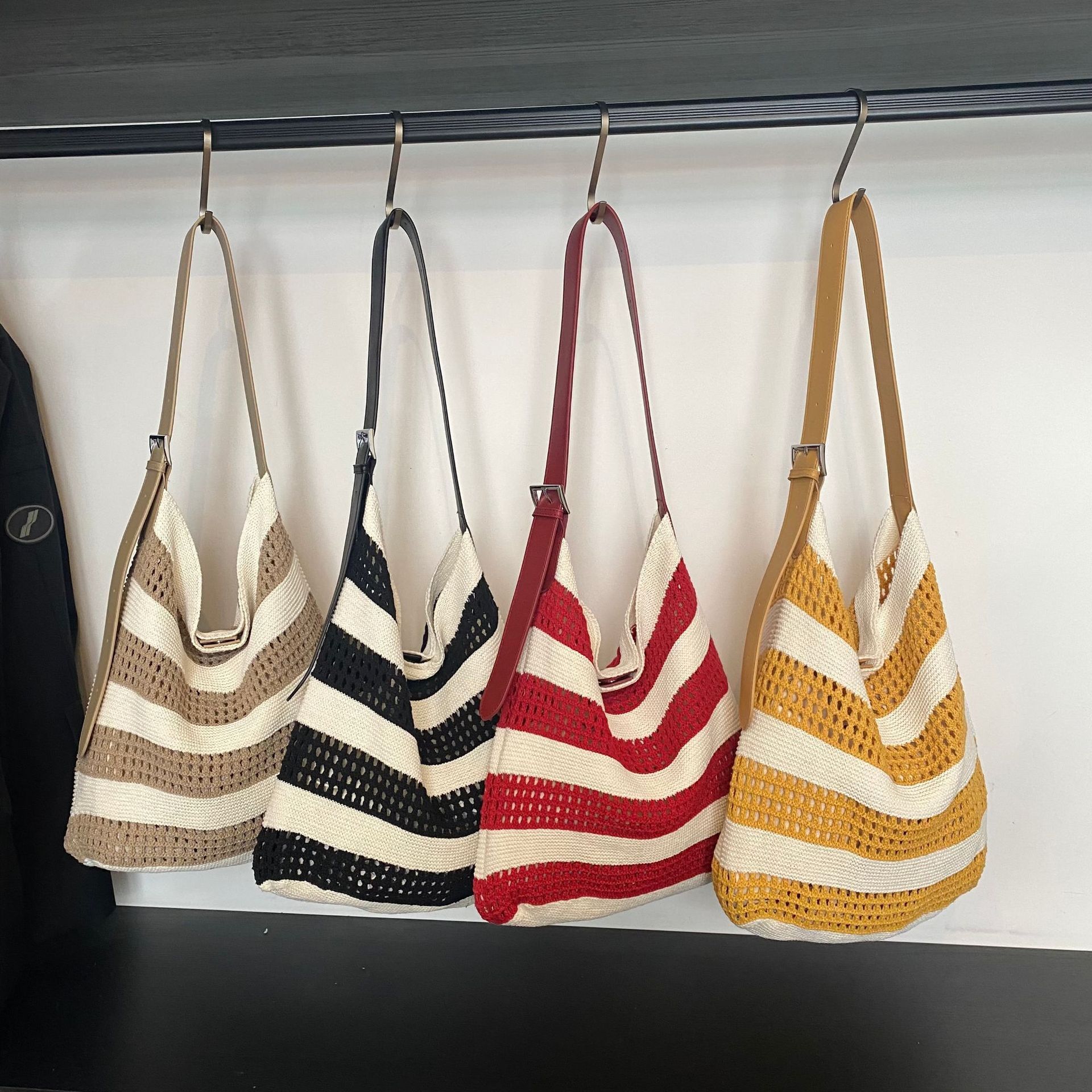 2025 Spring And Summer Striped Woven Bag Niche Design Contrast Color Striped Knitted Bag Women's Simple Hollow Hand-held Shoulder Bag