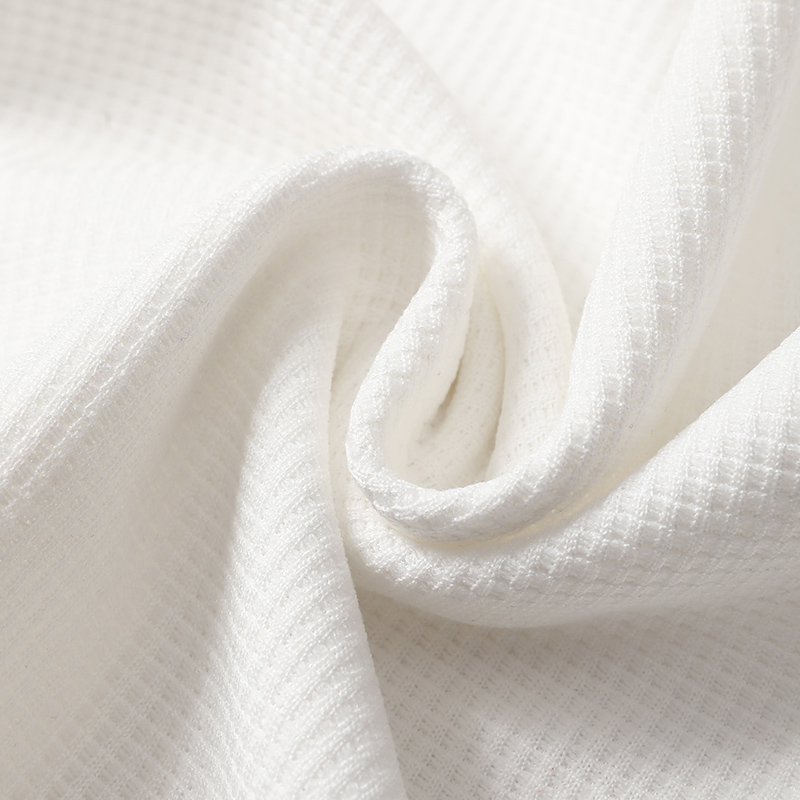 Summer boys' shorts set with waffle style short sleeves and letter printed shorts, suitable for children aged 4-12, featuring a stylish casual ou