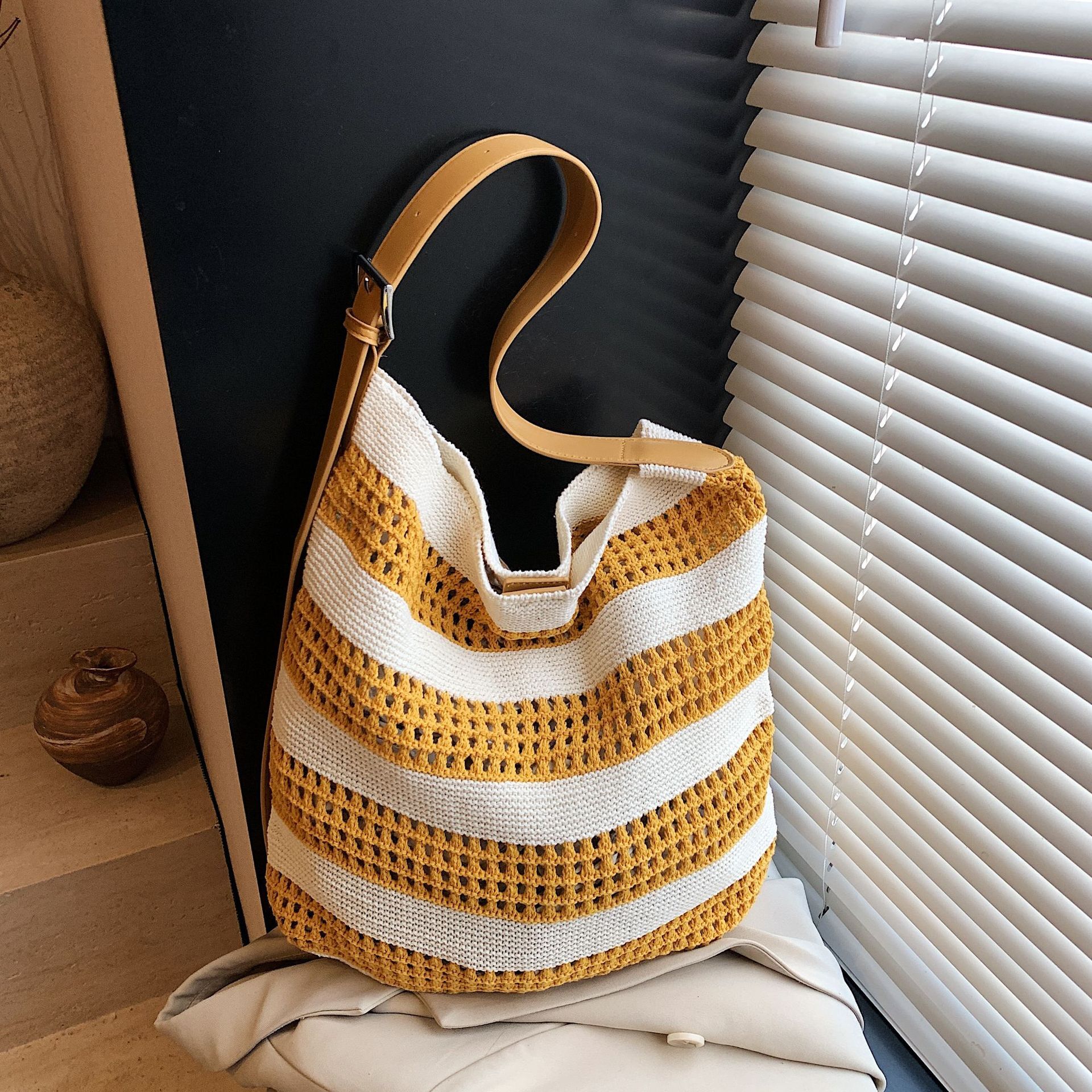 2025 Spring And Summer Striped Woven Bag Niche Design Contrast Color Striped Knitted Bag Women's Simple Hollow Hand-held Shoulder Bag