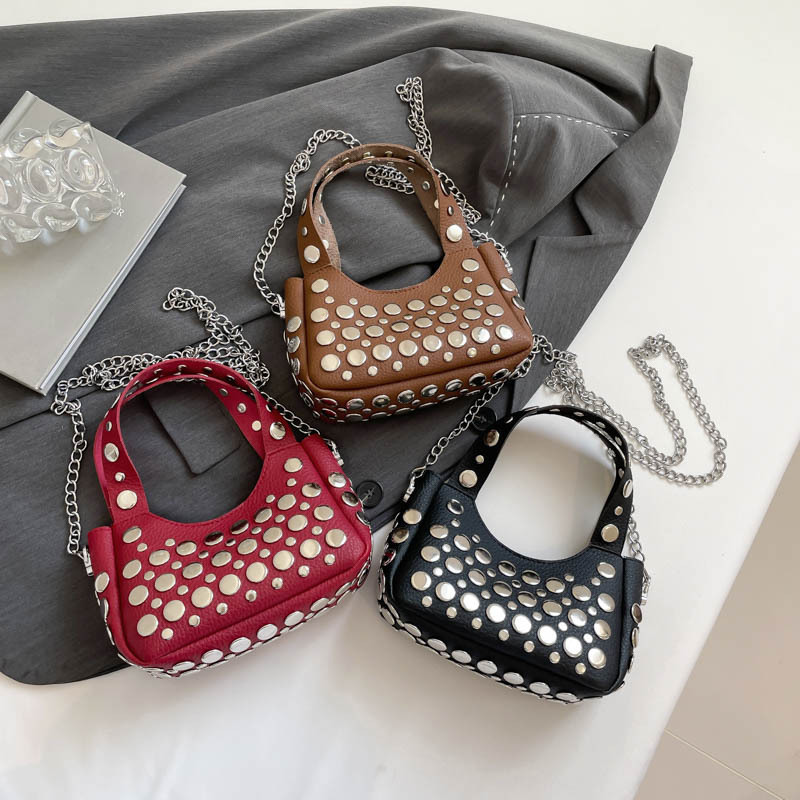 High quality brand new free designer bag 2025 new rivet fashion shoulder bag commuting bucket armpit bag handbag new free designer bag