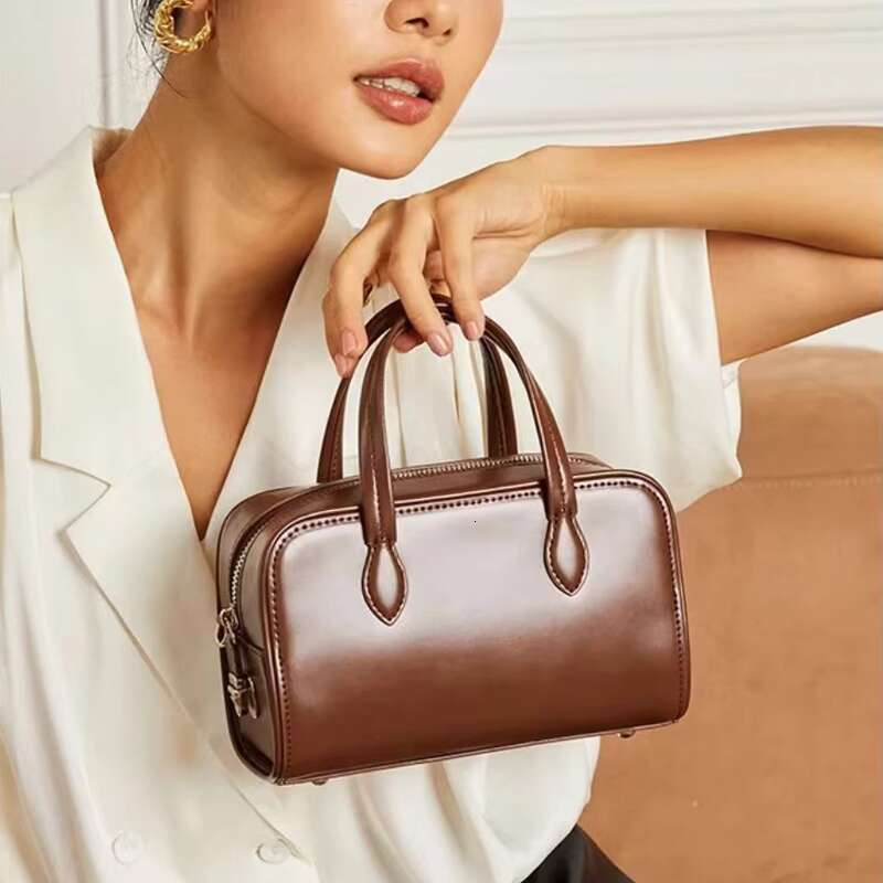 Genuine Leather Handheld Boston Pillow New Autumn Winter Niche High end Single Shoulder Crossbody Commuter Bag for Women