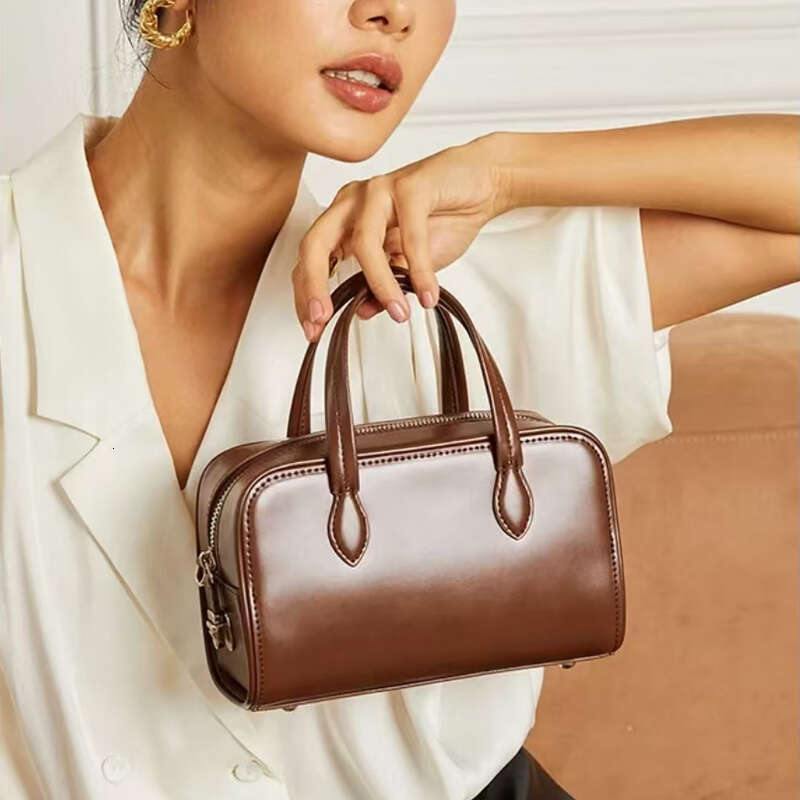 Genuine Leather Handheld Boston Pillow New Autumn Winter Niche High end Single Shoulder Crossbody Commuter Bag for Women