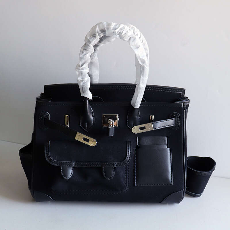 TIINO Canvas Splicing Drawstring Buckle Tote Single Shoulder Diagonal Crossover Head Layer Cowhide Handbag