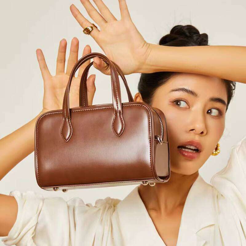 Genuine Leather Handheld Boston Pillow New Autumn Winter Niche High end Single Shoulder Crossbody Commuter Bag for Women