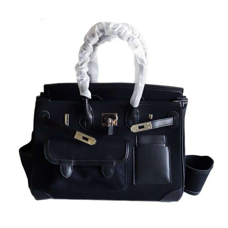 TIINO Canvas Splicing Drawstring Buckle Tote Single Shoulder Diagonal Crossover Head Layer Cowhide Handbag