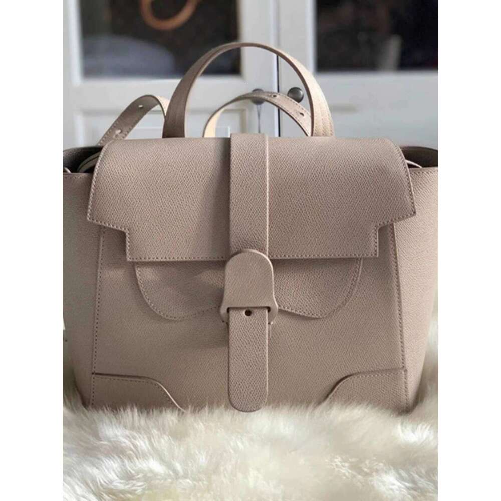 Early Spring New Ouyang Nana Style Commuter Niche Design Handheld Crossbody Shoulder Multi functional Women s Bag