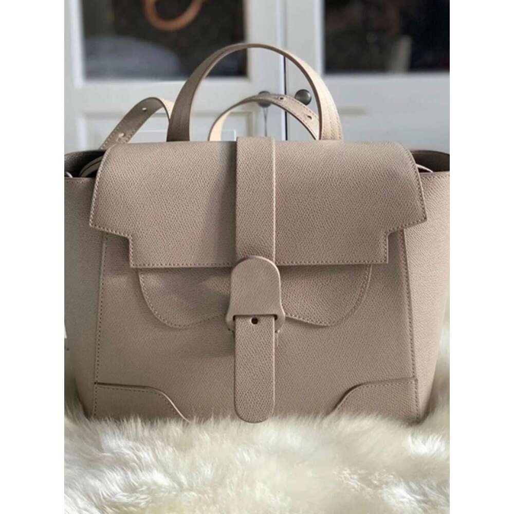 Early Spring New Ouyang Nana Style Commuter Niche Design Handheld Crossbody Shoulder Multi functional Women s Bag