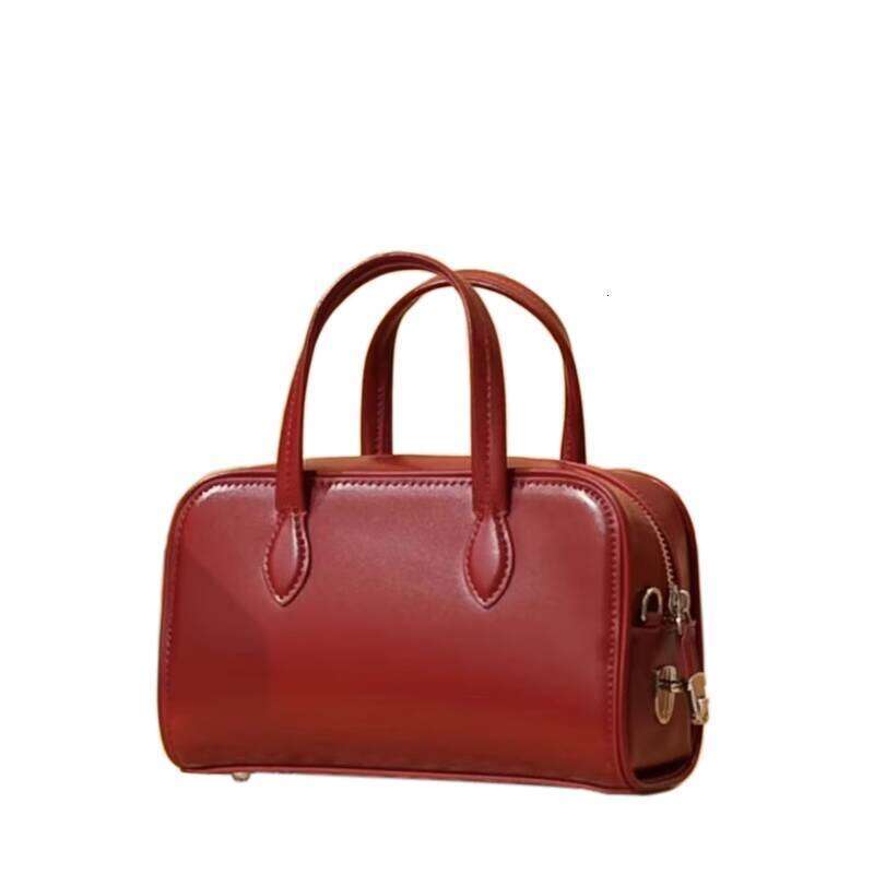 Genuine Leather Handheld Boston Pillow New Autumn Winter Niche High end Single Shoulder Crossbody Commuter Bag for Women
