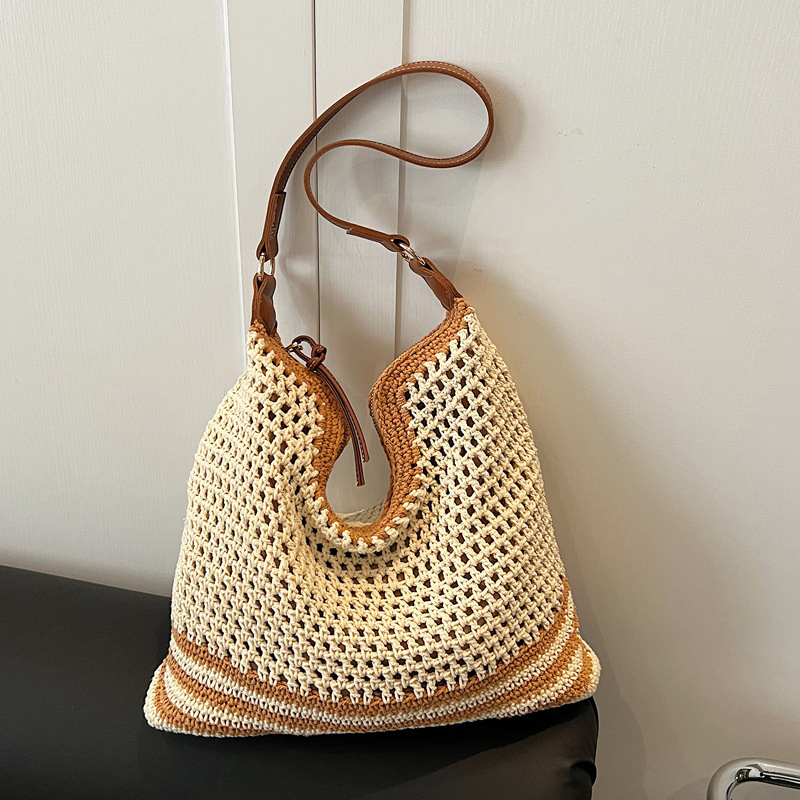 2025 new summer fashion hollow woven designer women's new style simple temperament single shoulder large capacity vacation women's bag
