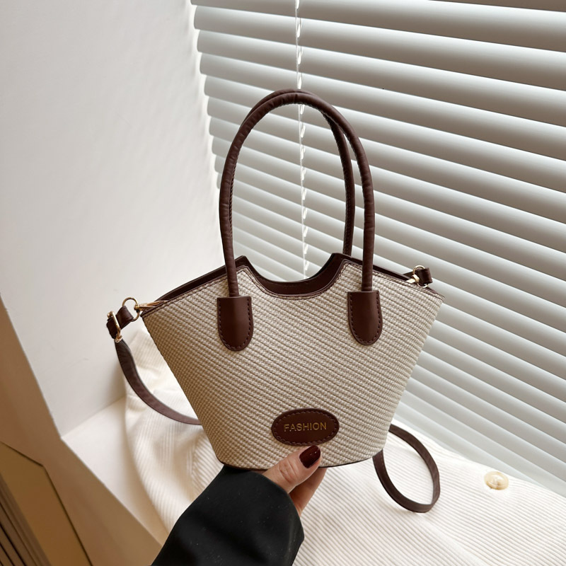 2025 new color blocked niche female fashion designer multifunctional cross body texture handheld bucket bag