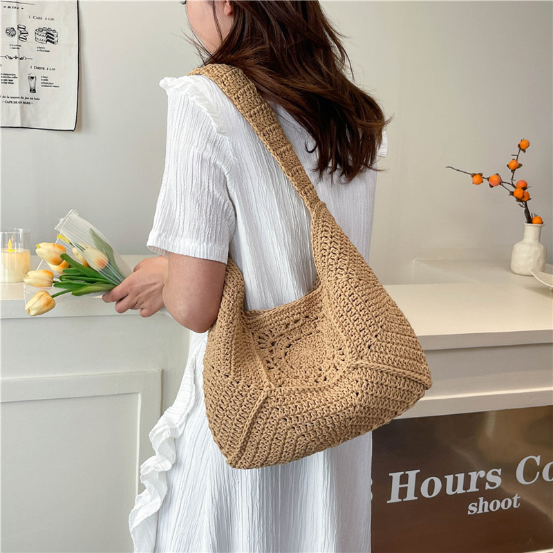 2025 new single shoulder large capacity cotton thread new grandmother grid grass woven vacation beach bag designer multifunctional women's bag
