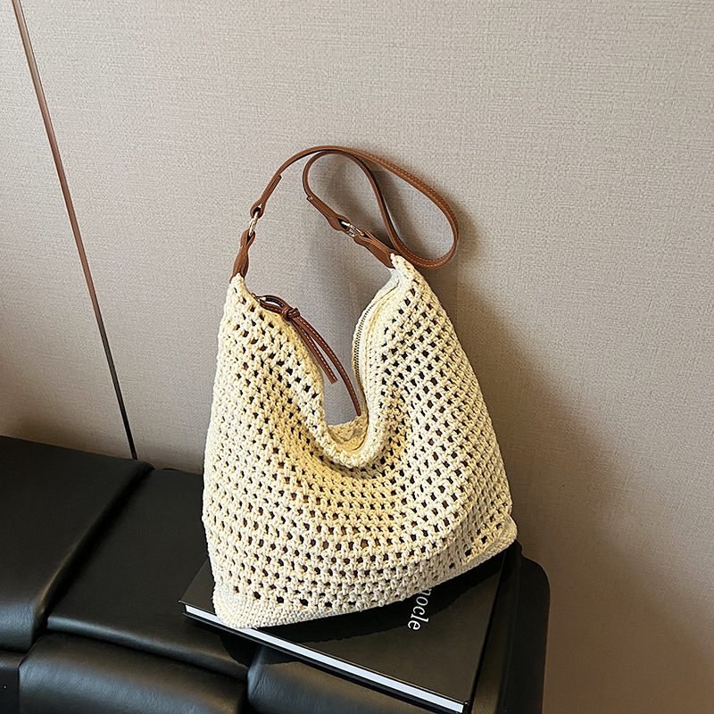 2025 new summer fashion hollow woven designer women's new style simple temperament single shoulder large capacity vacation women's bag
