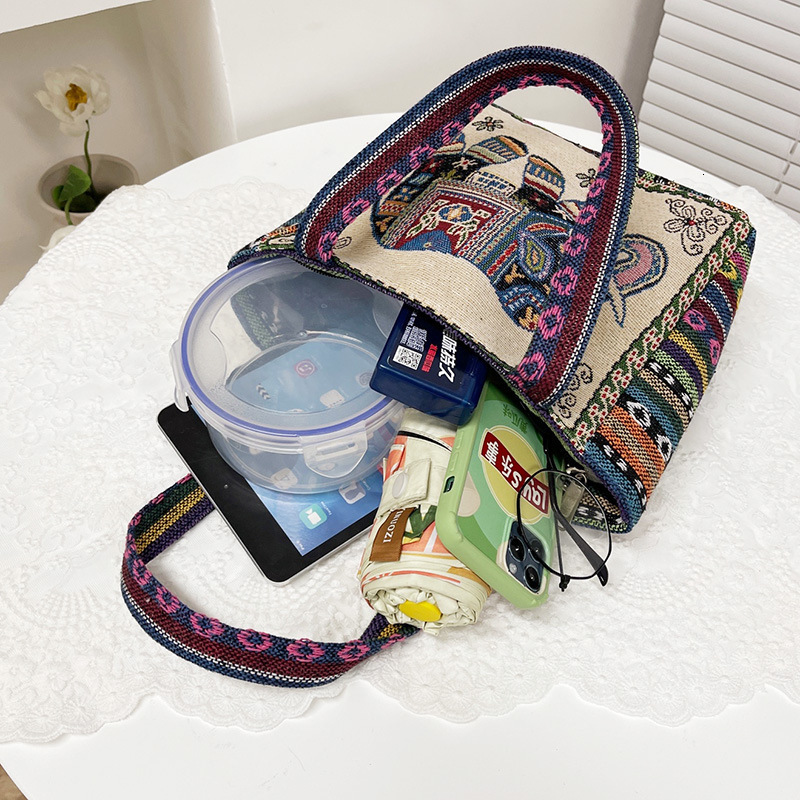 Top brand high-quality new item free delivery designer bag ethnic style embroidery handbag double-sided pattern handbag suitable for office workers