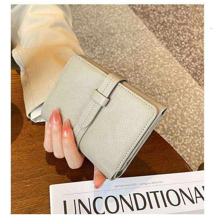 Ladies' short folding drawstring multifunctional large capacity wallet with niche design