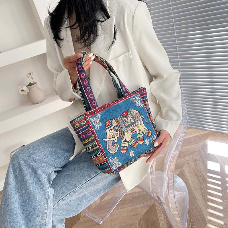 Top brand high-quality new item free delivery designer bag ethnic style embroidery handbag double-sided pattern handbag suitable for office workers