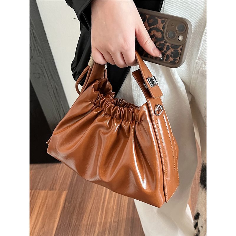 New women's bag small design unique pleated cloud bag new multifunctional commuting handbag fashion shoulder crossbody bag solid color retro desi