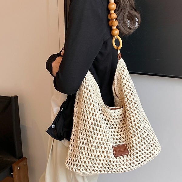 2025 New Beach Vacation Beach Weaving Designer Women's New Hollow Knitted Handbag Large Capacity Single Shoulder Underarm Bag