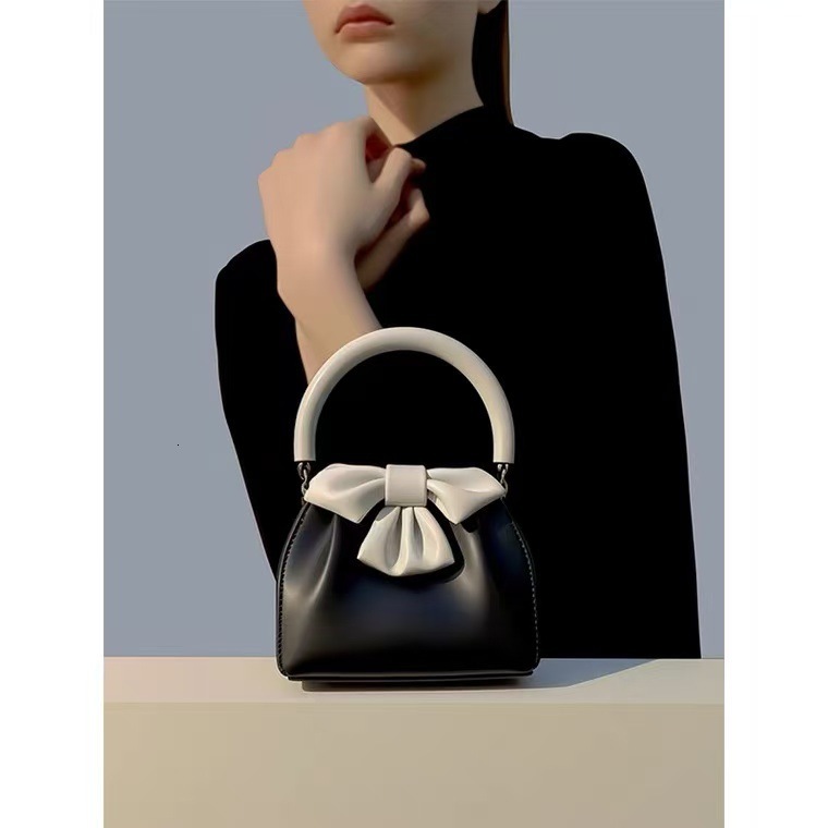 Top brand high-quality new free designer 2025 new French color block bow pleated handbag black handbag new free designer handbag