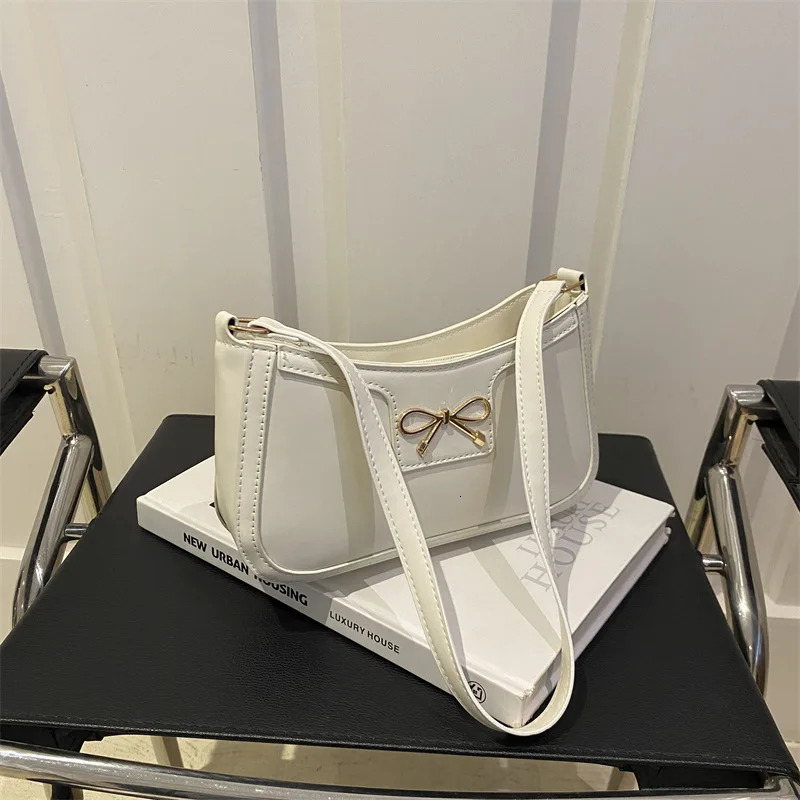 Stylish Shoulder Bag with Metal Bow Decoration Versatile Underarm Bag Classic Brown and Black Baguette Bag for Women Daily Use 250526