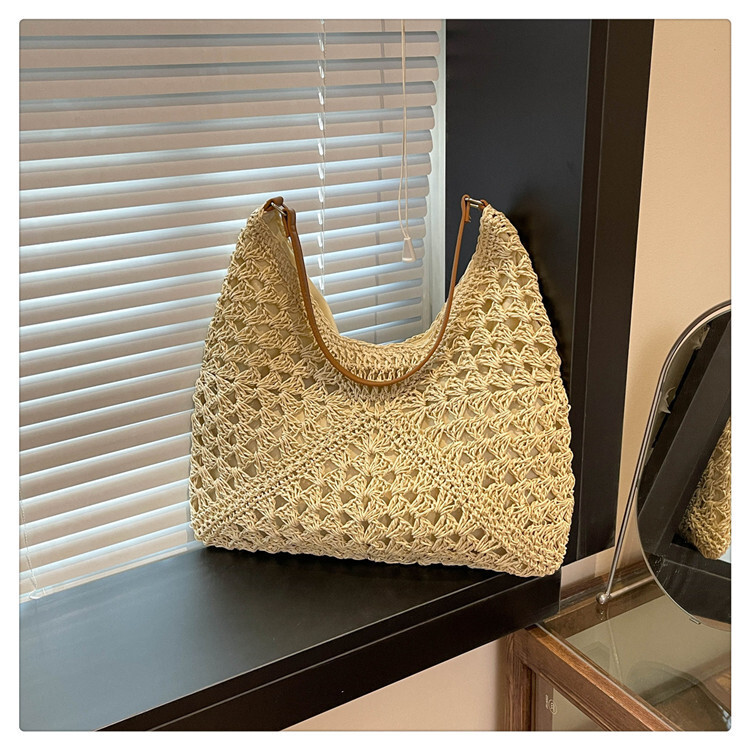 2025 new women's new hollow design beach vacation grass woven bag designer multifunctional single shoulder handbag