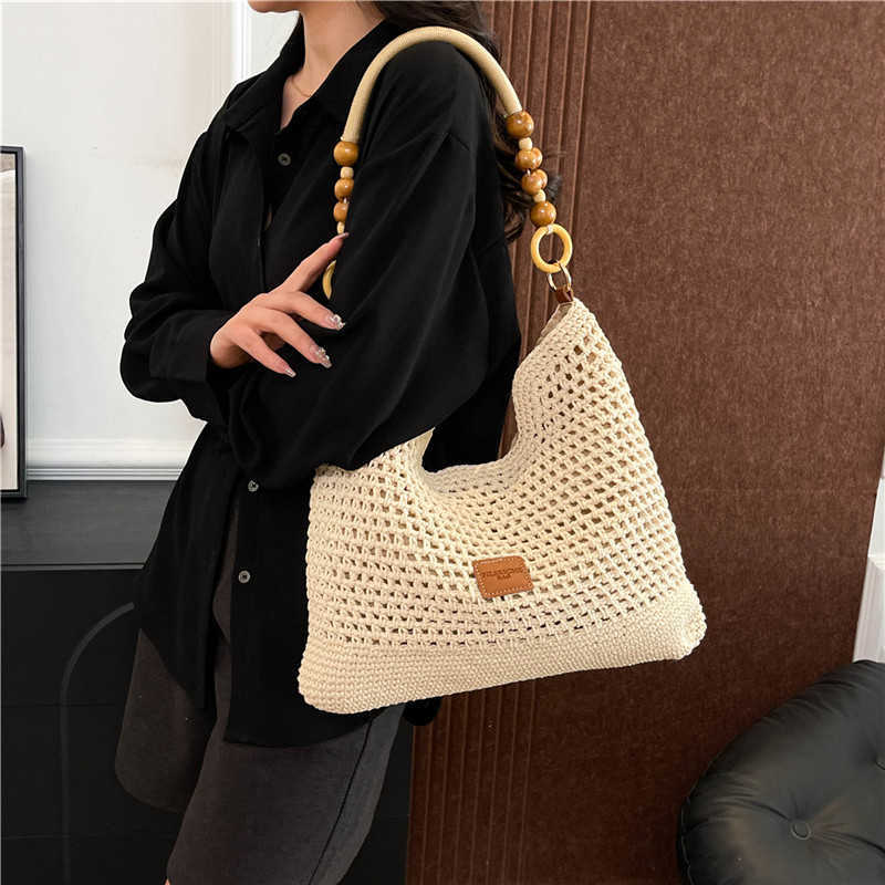 Spring Summer Fashion Hollow Weaving Bag for Womens Simple Shoulder Bag Large Capacity French Commuter Crossbody