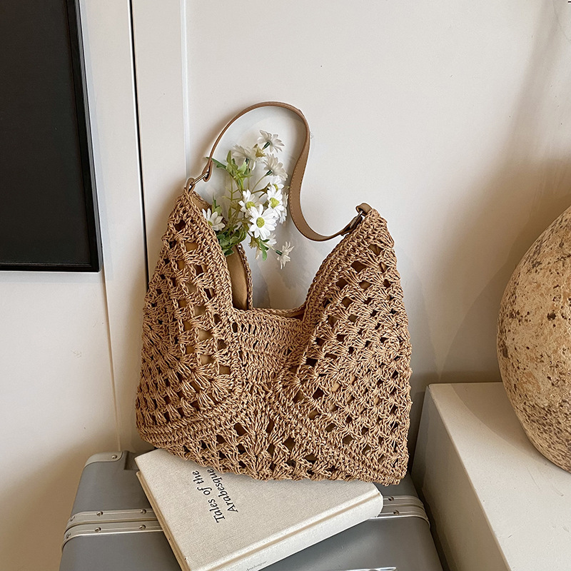 2025 new women's new hollow design beach vacation grass woven bag designer multifunctional single shoulder handbag