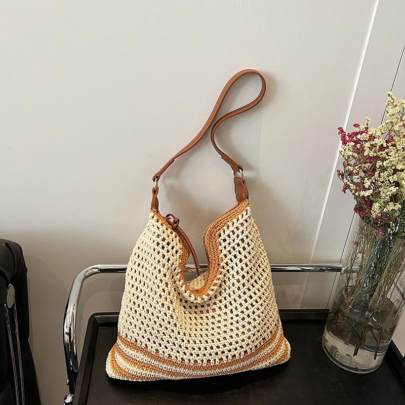 2025 new summer fashion hollow woven designer women's new style simple temperament single shoulder large capacity vacation women's bag