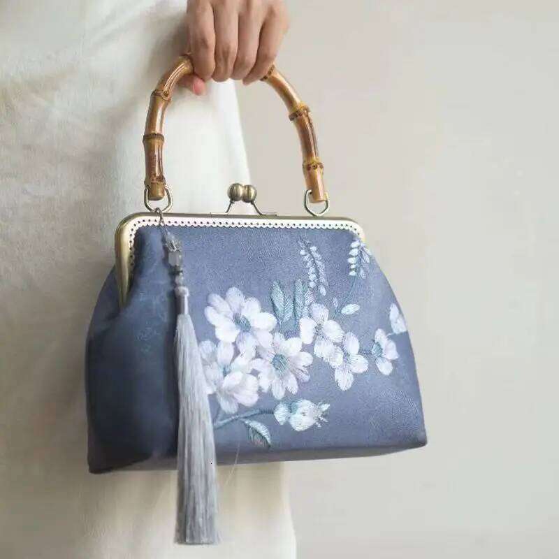 Luxurious and elegant embroidered silk geometric pattern Chinese style bamboo handle gift bag for middle-aged mother with tassel