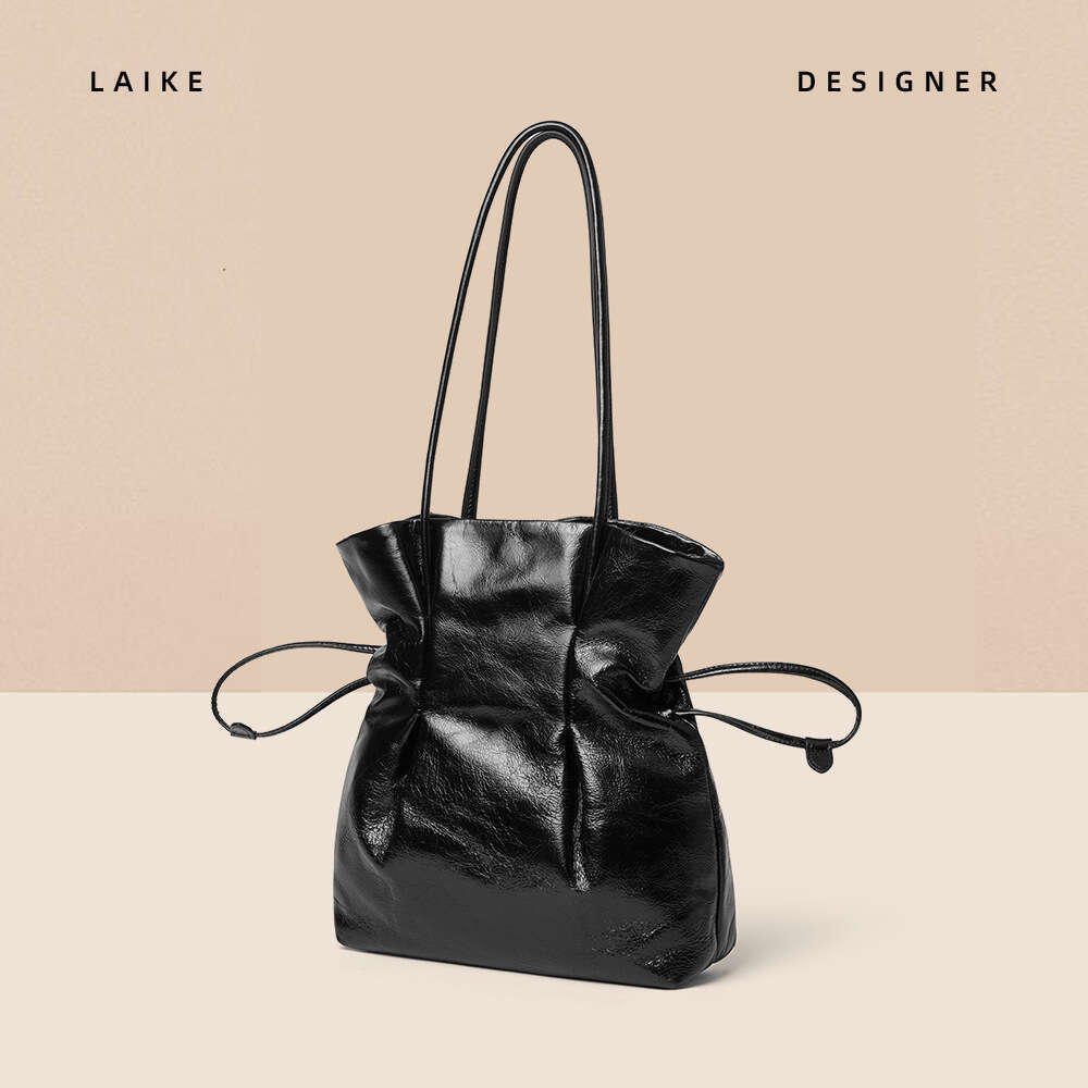 New French Style Niche Cowhide Handbag Lucky Shoulder Underarm Vase Small Waist Drawstring Fashion Women's Bag