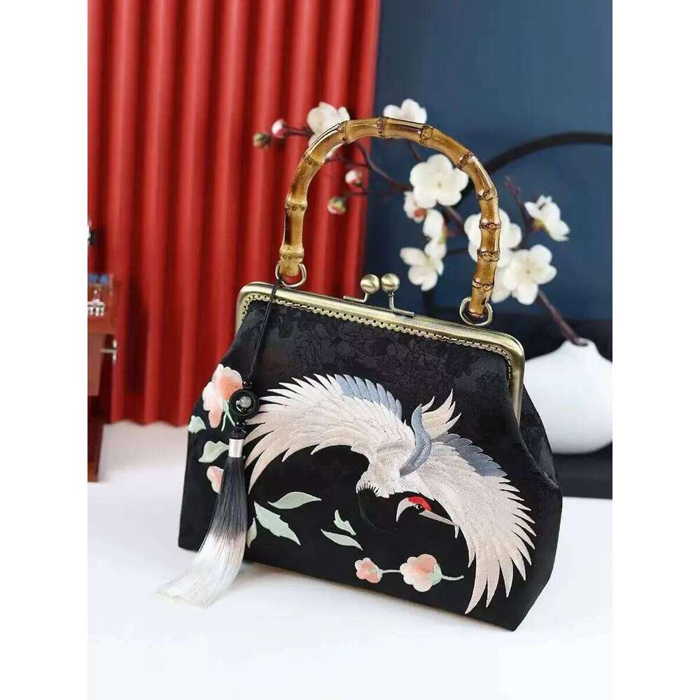 Luxurious and elegant embroidered silk geometric pattern Chinese style bamboo handle gift bag for middle-aged mother with tassel