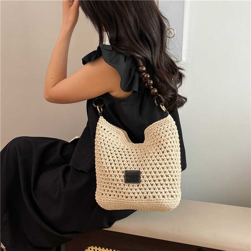 Spring Summer Fashion Hollow Weaving Bag for Womens Simple Shoulder Bag Large Capacity French Commuter Crossbody