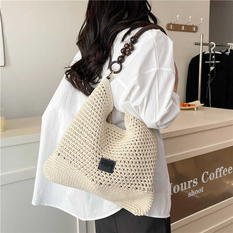 Spring Summer Fashion Hollow Weaving Bag for Womens Simple Shoulder Bag Large Capacity French Commuter Crossbody