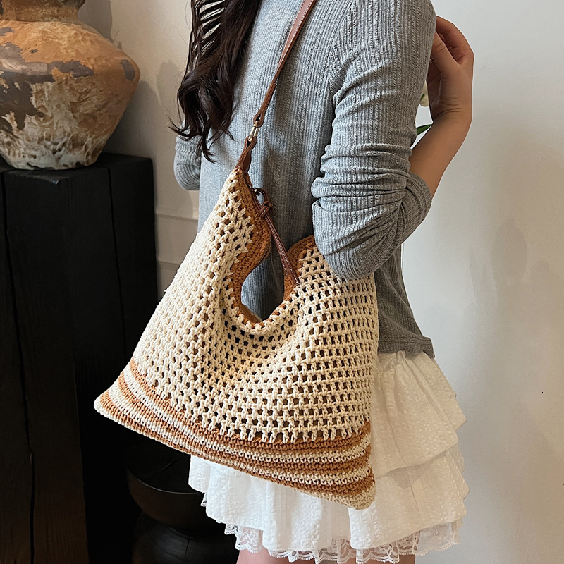 2025 new summer fashion hollow woven designer women's new style simple temperament single shoulder large capacity vacation women's bag
