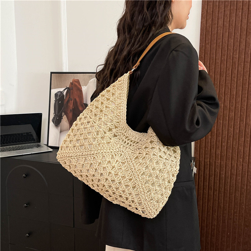 2025 new women's new hollow design beach vacation grass woven bag designer multifunctional single shoulder handbag