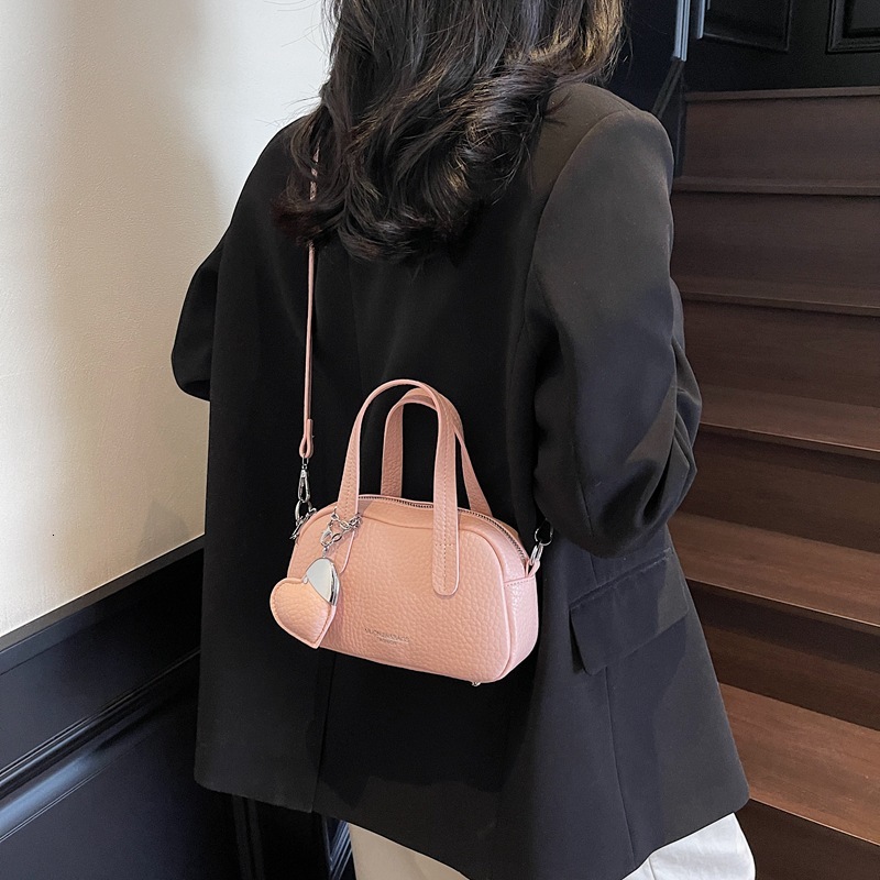 2025 New Lychee Pattern Fashion Designer Women's Handheld Pillow Western style Casual Simple Multi use Shoulder Cross Bag
