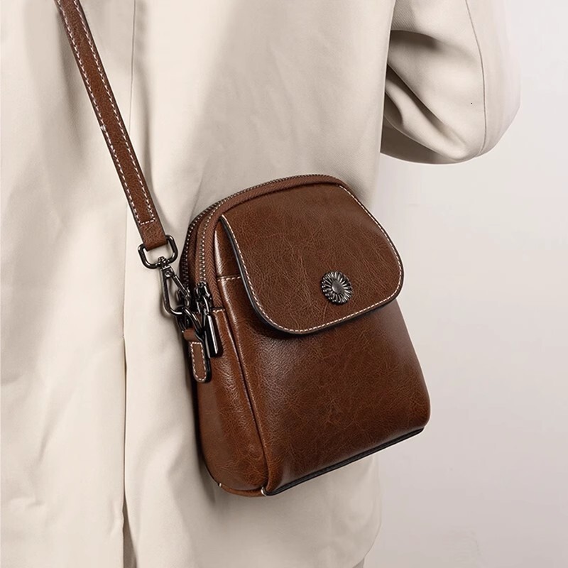 Genuine leather small 2025 new crossbody women's versatile vertical multi-layer shoulder fashionable and high-end mobile phone bag trend