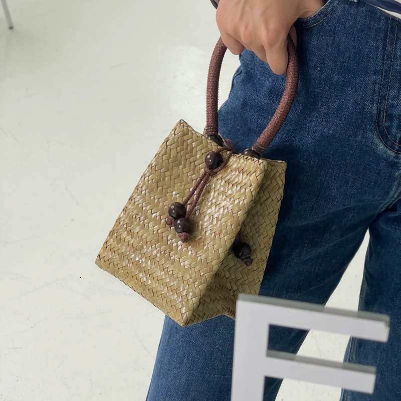 Free Shipping Designer Bag Thailand Imported Vintage Straw Woven Small Tote Bag With Wooden Buckle Solid Color Woven Bag Bucket Bag For Women