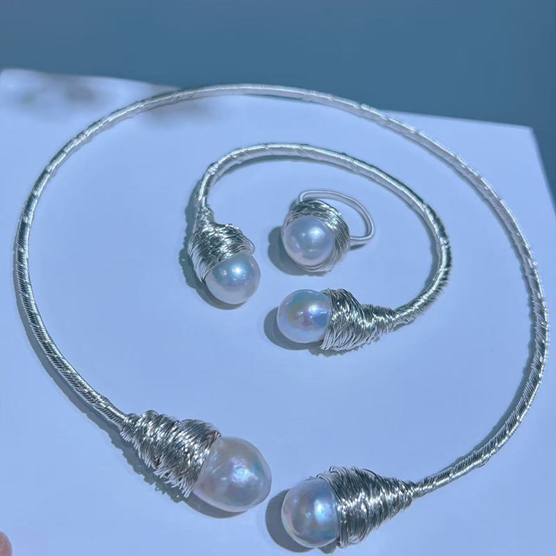 Chic Minimalist Pearl Accessory Pairing Featuring a Soft Choker Neckpiece Alongside a Coordinating Wrist Ornament