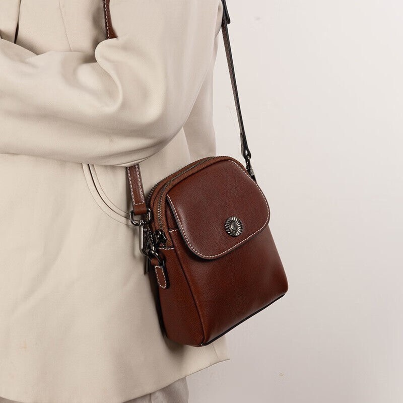 Genuine leather small 2025 new crossbody women's versatile vertical multi-layer shoulder fashionable and high-end mobile phone bag trend