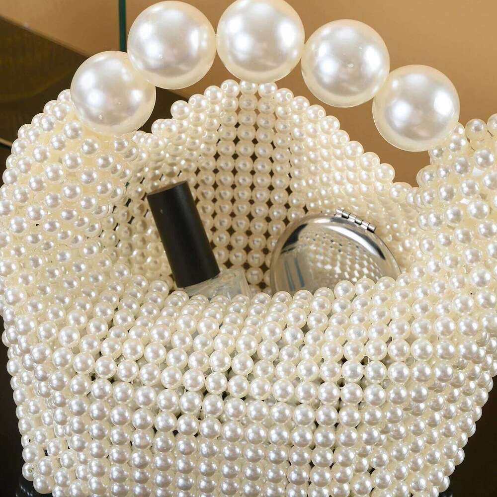 European and American style new beaded Summer women's pearl hand woven wrist bag Fashion temperament handbag